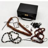 A collection of costume jewellery including amber necklace etc.