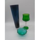 Three pieces of art glass including a Whitefriars small bubble bowl and modern dark teal vase