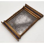 A small painted regency style mirror with gilt detailing 25 x 34cm