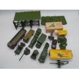 A collection of mainly Dinky Toys military die-cast vehicles and weapons including wagons, tanks,