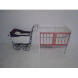 A child's vintage dolls pram and wooden cot
