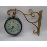 A modern Railway style double sided clock with metal hanging bracket