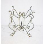 A wrought iron folding garden table base, height 71cm, length 51cm.