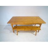A large pine table with a matching bench