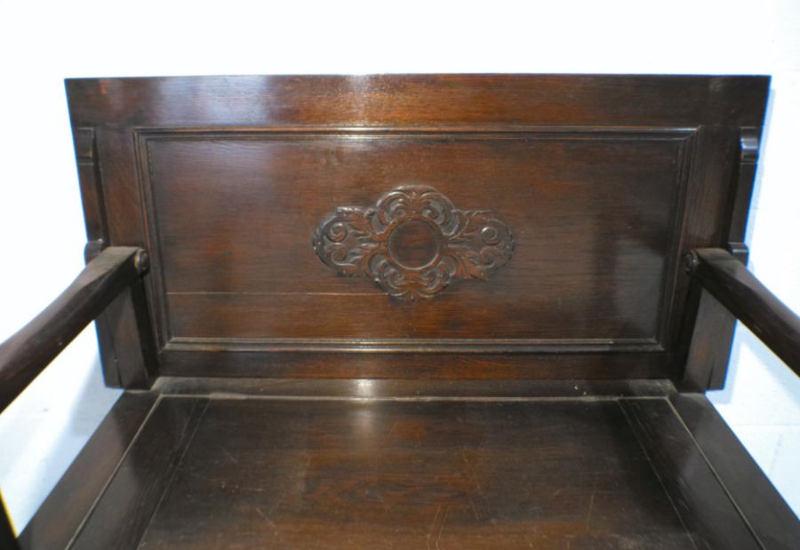 An oak monk's bench with lift up seat and carved detailing, marked 'Raleigh Furniture', length - Image 4 of 9