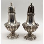 A pair of Sterling silver pepper pots, height 12.5cm