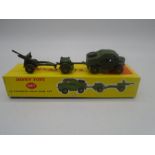 A vintage boxed Dinky Toys 25-Pounder Field Gun Set (No 697) in first issue yellow box