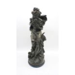 A bronzed figure of a semi-clad lady, signed 'Carrier Belleuse', height 60cm.