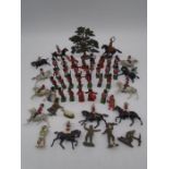 A collection of mainly lead military figurines, includes some plastic toy figures etc