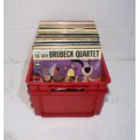 A quantity of 12" and 10" vinyl records including Dave Brubeck, Joan Baez, Billie Holiday, Ray