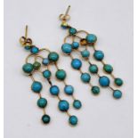 A pair of 19th Century unmarked gold and turquoise earrings with articulated knife edge drops