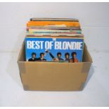A quantity of 12" and 7" vinyl records including UB40, Madness, Blondie, The B52s, The Rolling