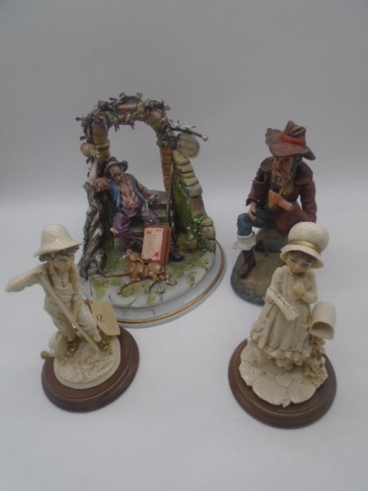 Two Capodimonte figurines including entitled "Hostaria il Respiro" by Roberto B, along with two