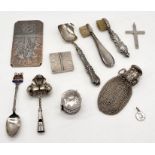 A collection of silver and SCM items including misers purse, pill pot, baby's rattle/whistle,