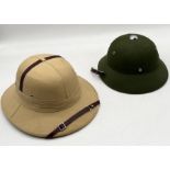 A Pith Helmet made by Ascot Top Hats along with a similar Vietnamese style helmet