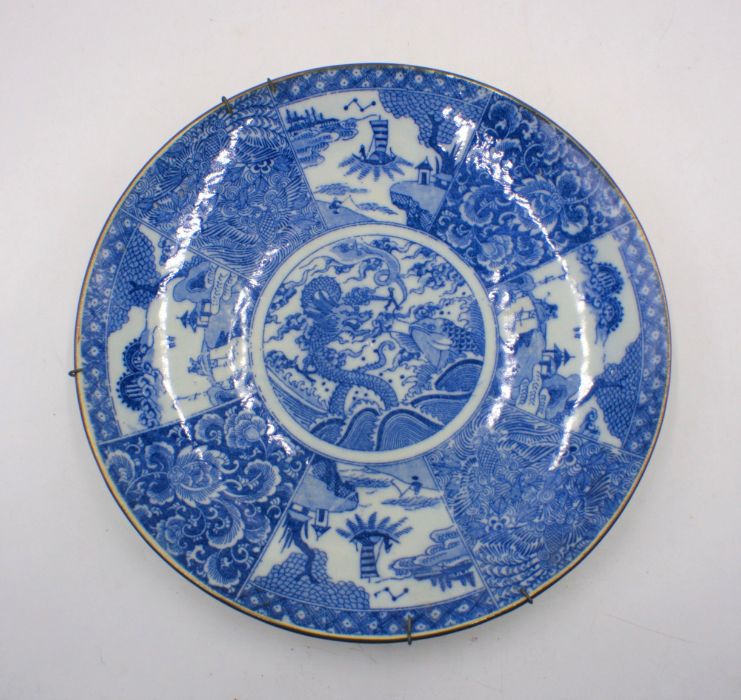 A blue and white ceramic Japanese charger.