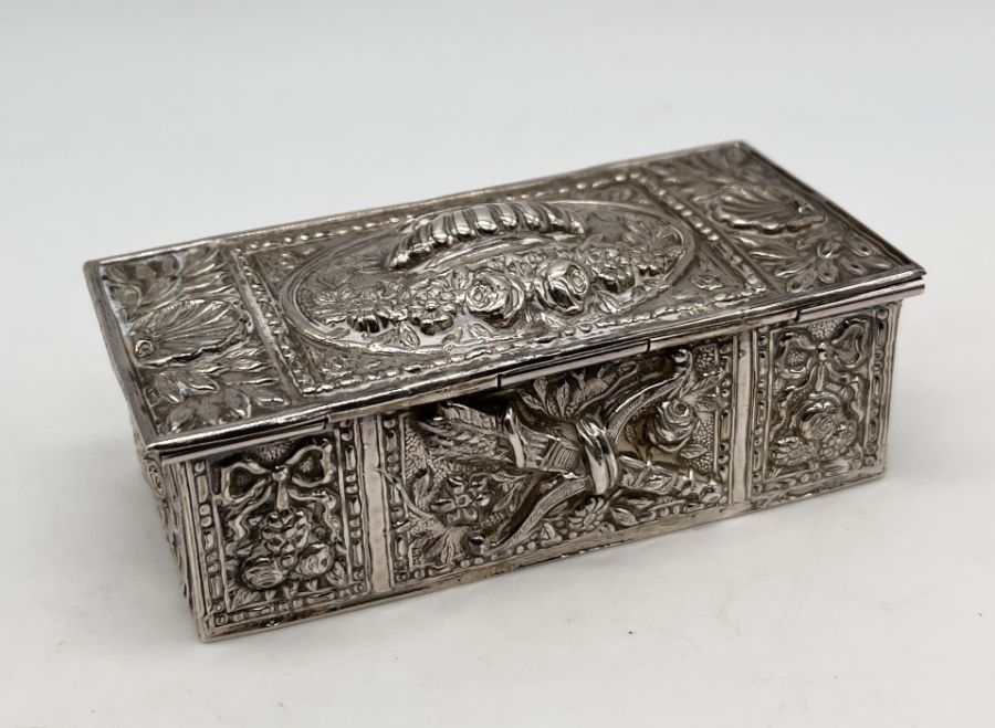 A small continental silver lidded box with embossed decoration and gilded interior - Image 2 of 3