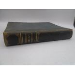 A leather bound copy of "The Harmsworth Atlas Gazetteer"