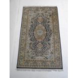 An Eastern blue ground rug - 210cm x 124cm