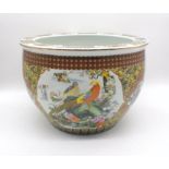 An Oriental ceramic fish bowl with character marks, diameter 42cm, height 29cm.