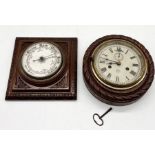 A vintage enamel dial barometer along with a wooden rope edged clock