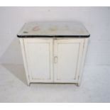 A vintage white painted cupboard with enamel top, length 76cm, depth 46cm, height 78cm.