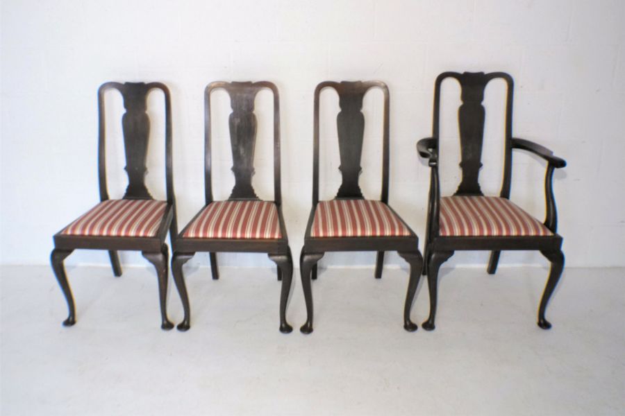 A set of four 'Warings' Queen Anne style mahogany dining chairs, including one carver.