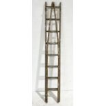 A vintage wooden decorators ladder with tapered end