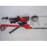 A quantity of gardening equipment including a Black & Decker GT220 hedge trimmer, a Flymo Sabrecut