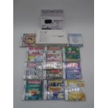 A boxed Nintendo DS console, along with a selection of games and Gamexpert 8 in 1 Essential Pack -