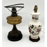 An antique oil lamp A/F along with a Mason's table lamp