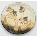 A Moorcroft "Cone Flower" plate (2001) - stamped mark to base - diameter 26cm