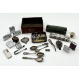 A collection of miscellaneous items including silver, lighters, travelling inkwell, military badges,