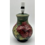 A Moorcroft "Hibiscus" lamp base, impressed mark to base - overall height 34cm