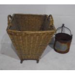 A wicker two handled basket, along with a vintage metal well bucket