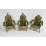 Three weathered rustic garden steamer style chairs.