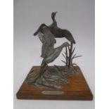 An A R Brown pewter sculpture of Mallards in reeds, mounted on oak base, height approx. 14cm