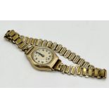 A 9ct gold ladies cocktail watch on gold plated strap
