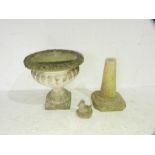 A reconstituted stone garden urn along with a small duck etc.