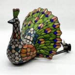 A Tiffany style novelty table lamp in the form of a peacock - 28cm high