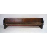 A Victorian pitch-pine church pew with kneeler pad to back - length 305cm, depth 64cm.