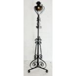 A wrought iron telescopic oil lamp