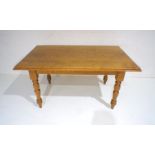 An oak farmhouse table on turned legs, length 153cm, depth 92cm, height 77cm.