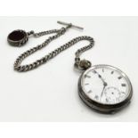 A hallmarked silver pocket watch with silver Albert and swivel fob