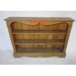 A pine bookshelf 127cm x 25cm, height 92cm