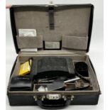 A vintage Polaroid 180 land camera with extras all in a branded hard case