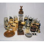 A cognac dispenser along with a collection of drinking steins, tobacco jar, ash trays etc.