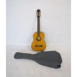 A Musima classical acoustic guitar with soft gig bag (1 string needing replacement)