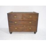 A Regency mahogany base of a linen press with four drawers raised on turned feet - length 123cm,