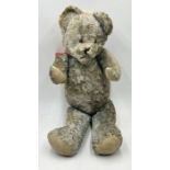 A large vintage blue teddy bear with jointed limbs - height 77cm